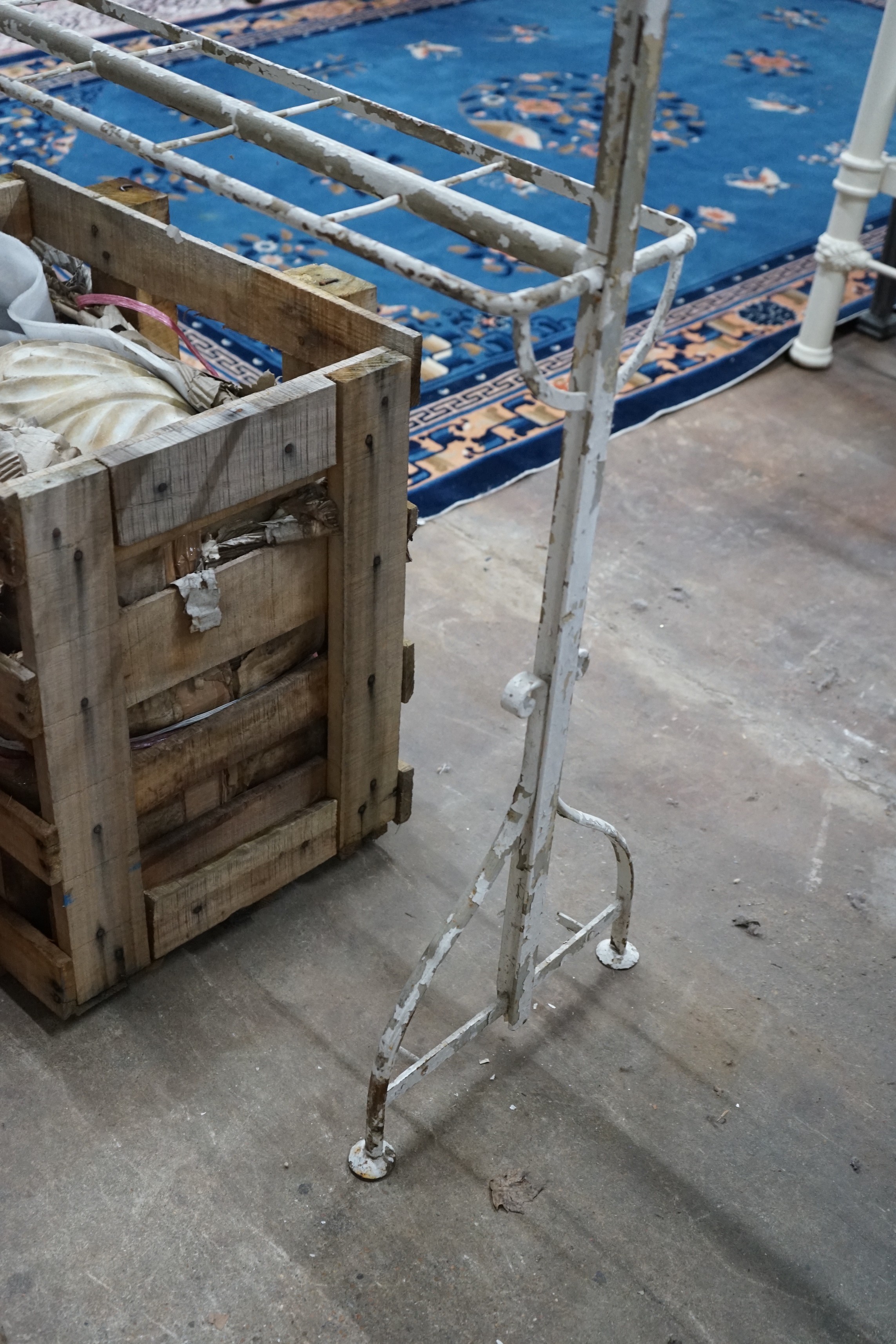 A vintage wrought iron coat and stick stand, width 200cm, height 206cm